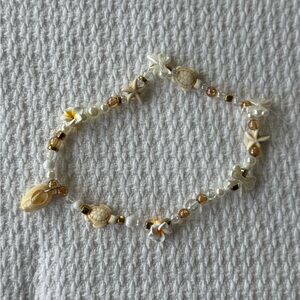 Handmade Beige Neutral Seashell Starfish Bow Glass Beaded Stretch Phone Charm